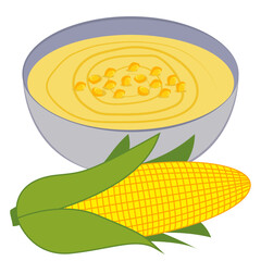 bowl with corn soup and fresh corn.