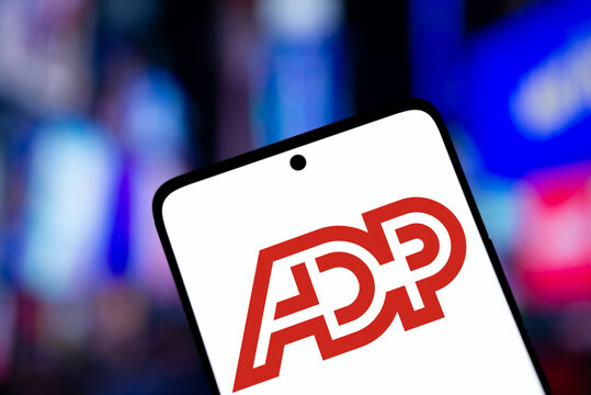 Dhaka, Bangladesh- 11 Dec 2024: ADP logo is displayed on smartphone. Automatic Data Processing Inc is an American provider of human resources management software and services company.
