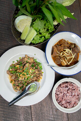 Traditional Thai Meal: Spicy Minced Pork Salad with Herbal Vegetables