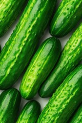 top-down view of fresh cucumbers arranged in neat rows bright studio lighting