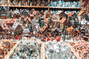 Tons of various Christmas village houses displayed for sale at a Chrirstmas Market in Salzburg Austria