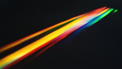 Abstract colorful light streaks on black background.