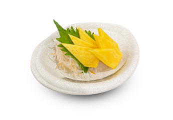 Japanese tamago sashimi (sweet omelette) served on a white ceramic plate with shredded daikon radish and shiso leaf.