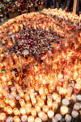 Candles around a heart shaped by flower petals in honor to Virgen de Guadalupe at Iglesia de Guadalupe located in Matamoros, Tamaulipas, México.