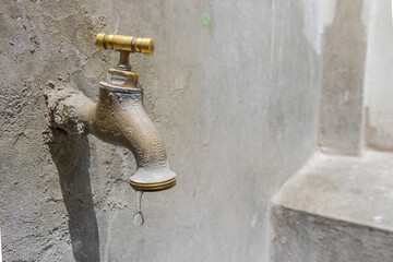 Spout with trough, sink with faucet, pipe and cement sink. Washing, drinking water, open water,...