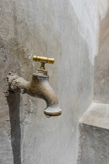 Spout with trough, sink with faucet, pipe and cement sink. Washing, drinking water, open water,...