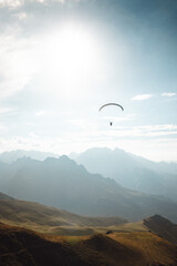 A paraglider flies into the heart of the French Pyrenees mountains
