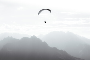 A paraglider flies into the heart of the French Pyrenees mountains