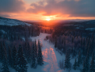Aerial view of beautiful winter landscape in Lapland during sunset.