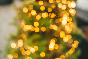 Abstract background with golden glitter bokeh lights.