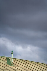 clouds over a green roof
