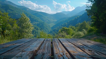 Fototapeta premium Rustic wooden table overlooking a breathtaking mountain valley landscape.