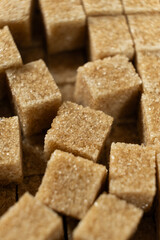 Macro cubes of brown cane unrefined demerara sugar.
