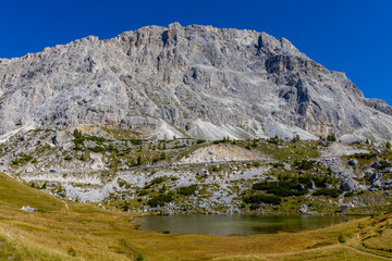 Lake in the Dolomite Alps summer sunny weather landscape. Mountain reflection in the lake in the Dolomiti Alps, South Tyrol, Italy