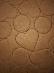 Preparing heart and circle shaped cookies from dough for valentine's day