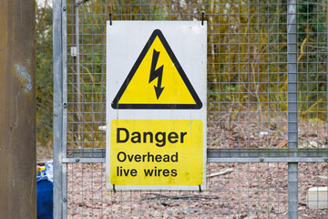 Danger overhead live wires warning sign
