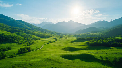 Obraz premium Serene mountain landscape with lush green meadows under a clear sky; perfect for peaceful and tranquil themes.