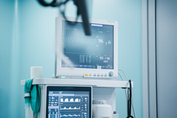 Advanced high tech medical monitors are continuously displaying vital signs in a modern clinical...