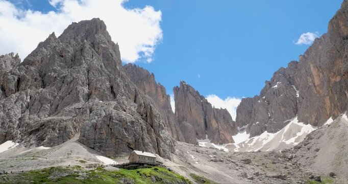 Sassolungo langkofel mountain refuge at the beginning of summer, Dolomites Alps, Italy