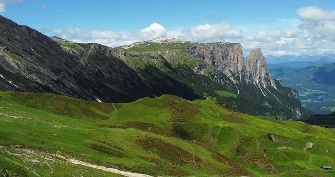 Panorama of Alpe Di Siusi near Seis Am Schlern and Compatsch with a view on Monte Pez on summer, Dolomites Mountains, Italy
