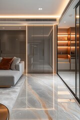Modern apartment interior with sleek grey cabinetry, marble floor, and warm lighting.