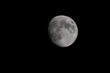 Waxing gibbous moon in the night.