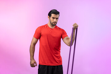 Full body length gaiety shot athletic and sporty young man with fitness elastic resistance band in...