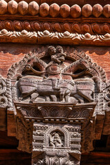 Fototapeta premium Wooden carved detail of an ancient building in Bhaktapur, Kathmandu valley, Nepal. Architectural detail.
