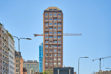 Urban Building with Construction Crane in the Background