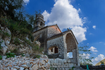 Obraz premium The Church of Our Lady of Remedy on the slope of St. John mountain above Old Town of Kotor, Montenegro.
