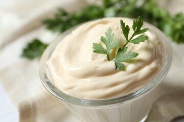 Bowl with mayonnaise on the table