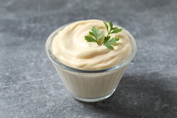 Bowl with mayonnaise on the table