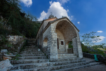Fototapeta premium The Church of Our Lady of Remedy on the slope of St. John mountain above Old Town of Kotor, Montenegro.