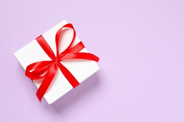 Beautiful gift box on color background