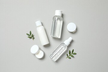 Natural cosmetic products on gray background, top view