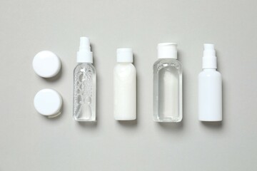 Natural cosmetic products on gray background, top view