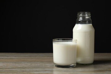 Glass and bottle of milk on the table