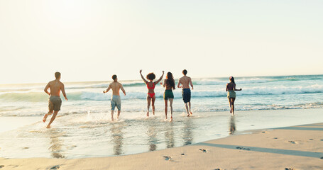 Summer, beach and friends on holiday, vacation or travel for relax, fun and play in bonding together. People, adventure and back for break, happiness and outdoor as group in swimwear with diversity