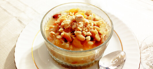 Ashure dessert with legumes and dried fruits named aşure or asure . Noah’s pudding in the bowl.