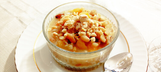 Ashure dessert with legumes and dried fruits named aşure or asure . Noah’s pudding in the bowl.