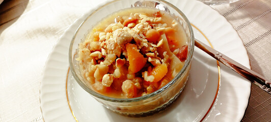 Ashure dessert with legumes and dried fruits named aşure or asure . Noah’s pudding in the bowl.
