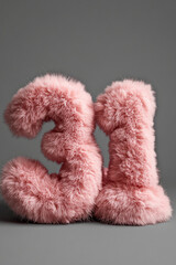 Fototapeta premium Plush pink numbers create a cozy and playful atmosphere for celebrations or decor during special occasions