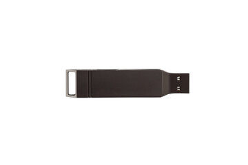 A dark gray USB flash drive on a white background.
Close-up studio shot USB drive.