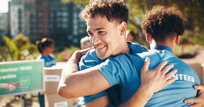 Hug, smile and volunteers for charity, men or collaboration of friends, outdoor activity and support. Team, park and happy people with project for nonprofit, helping or proud of community service - Powered by Adobe