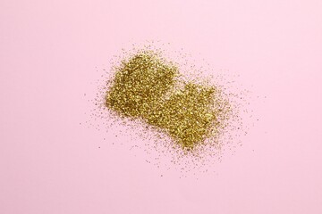 Beautiful golden confetti on a color background
