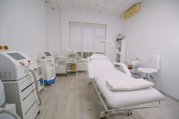 The interior of the massage and cometology salon, massage table. Nobody.