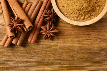 Aromatic cinnamon and anise stars on a wooden background