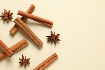 Aromatic cinnamon and anise stars on a color background