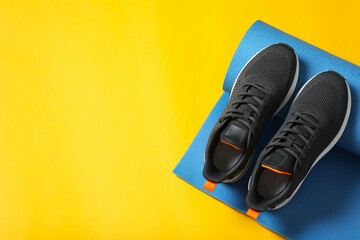 Sport equipment on color background, top view