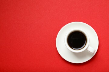 Cup of coffee on color background
